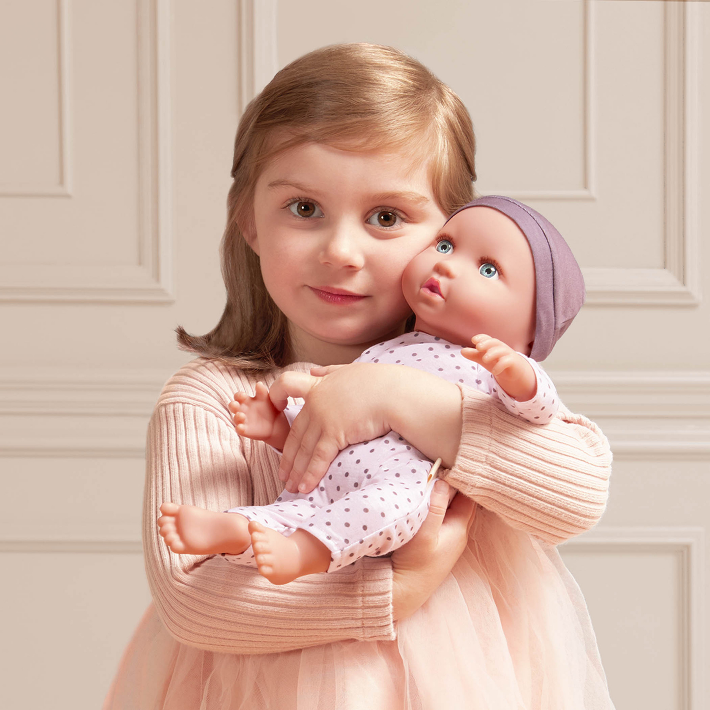 Muñeco bebé con gorro lila y ojos azules - modelo #1 Lullababy