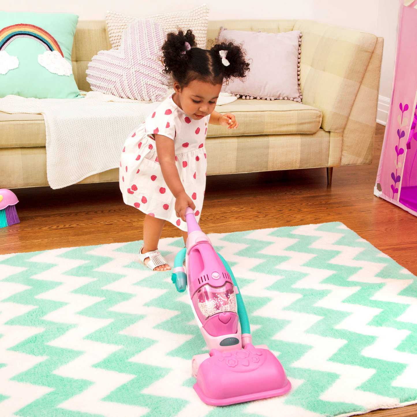 Aspiradora rosa con sonido